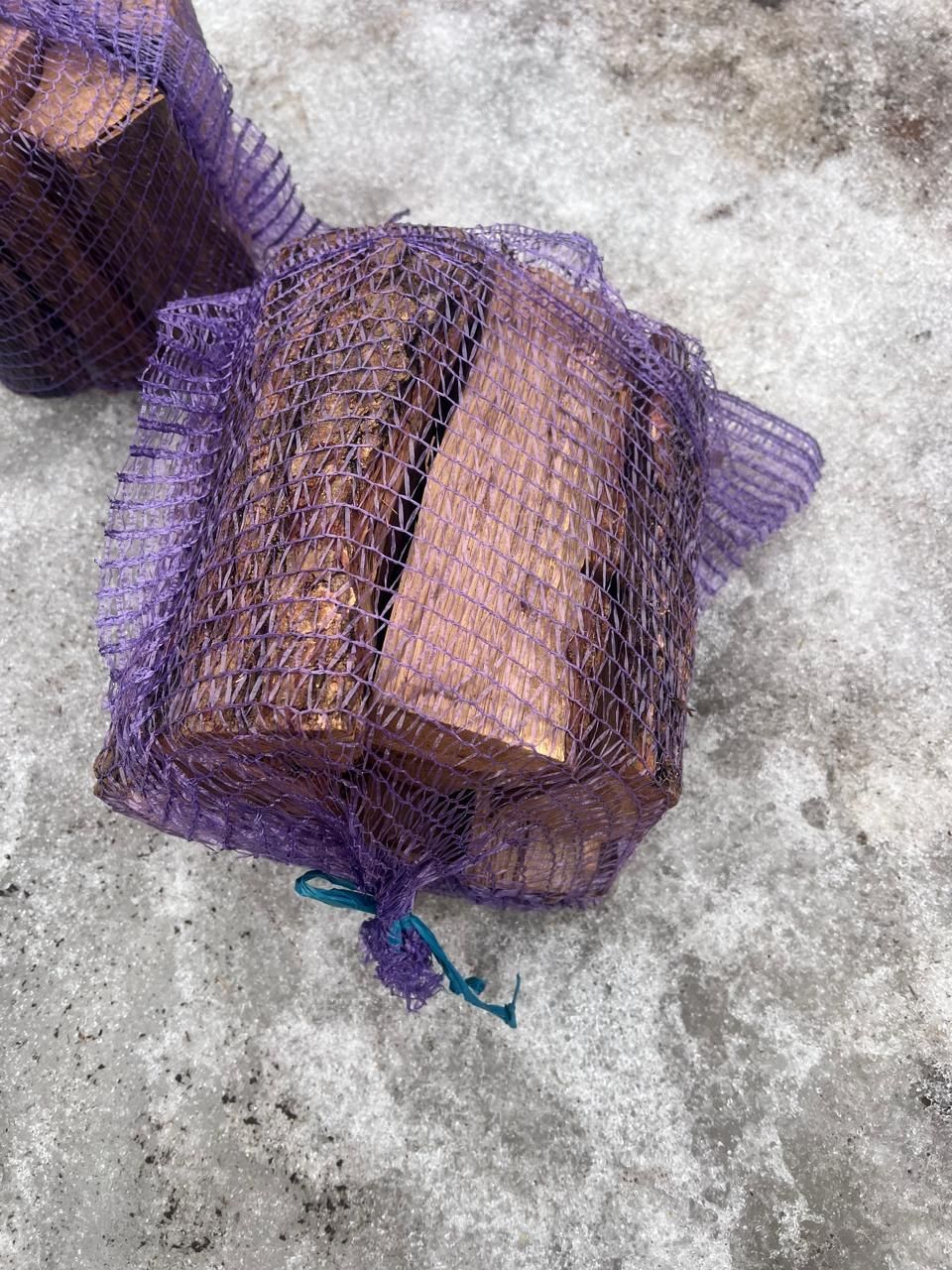 Net bag of kiln-dried firewood