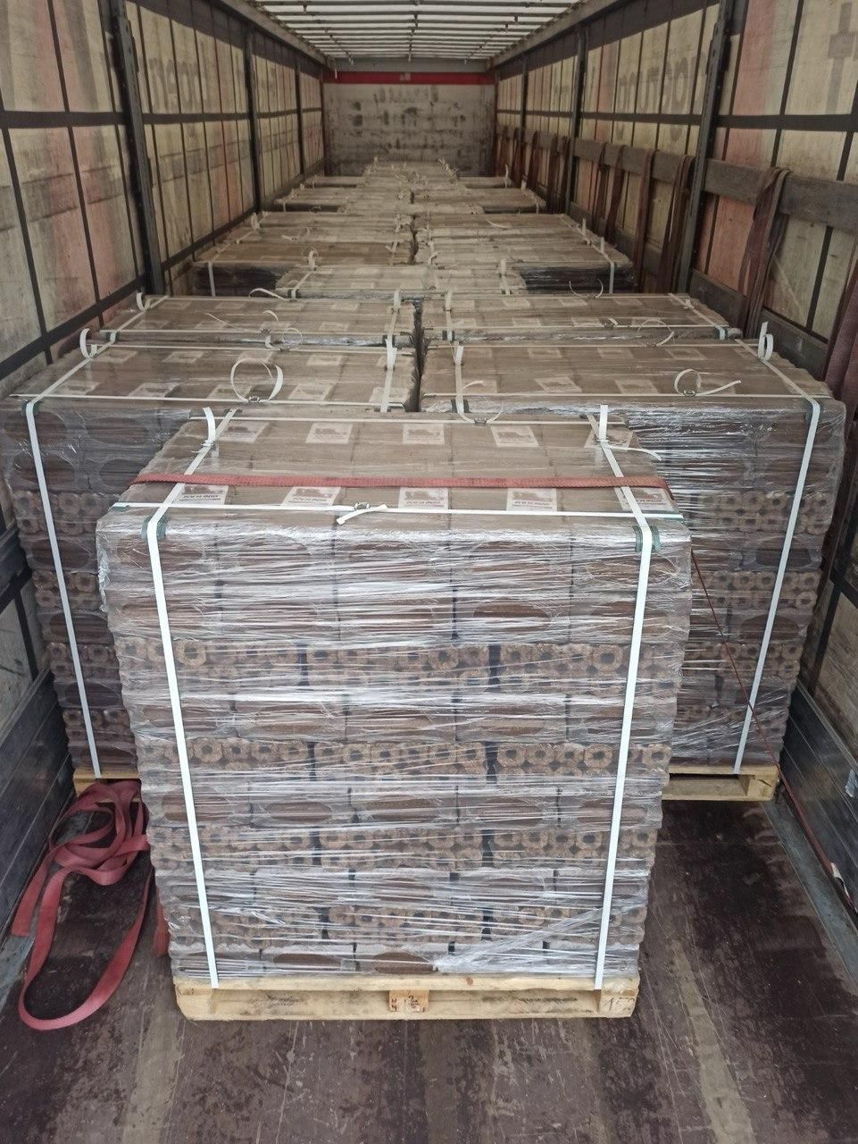 Pini Kay briquette pallets loaded in a truck